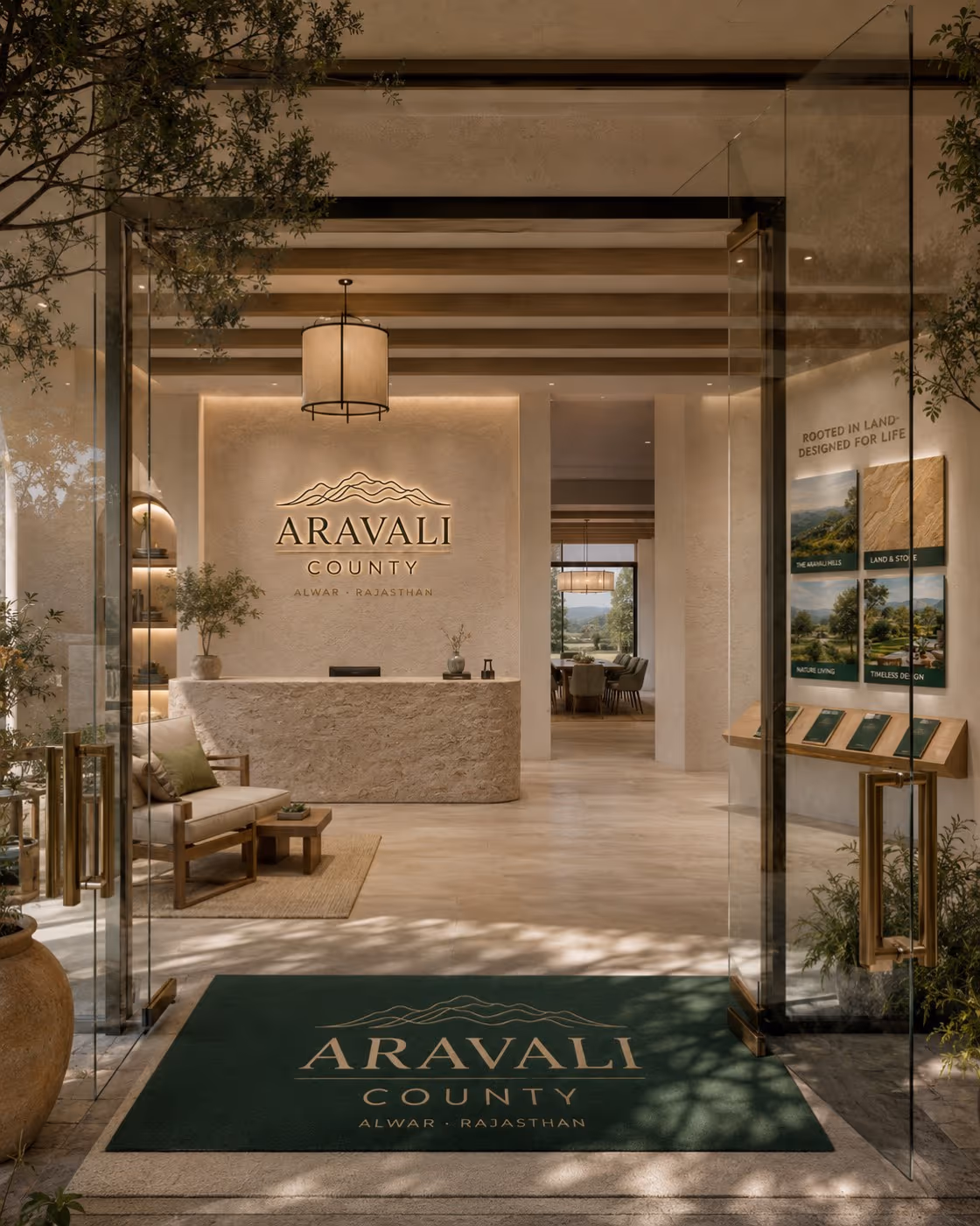 Aravali County arrival — the identity on the wall, the mat and the display boards at the entrance
